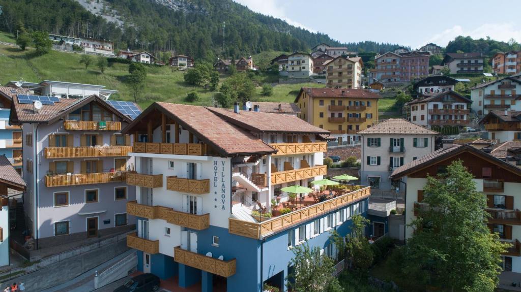 a view of a town with buildings at Hotel Garnì Villanova in Molveno