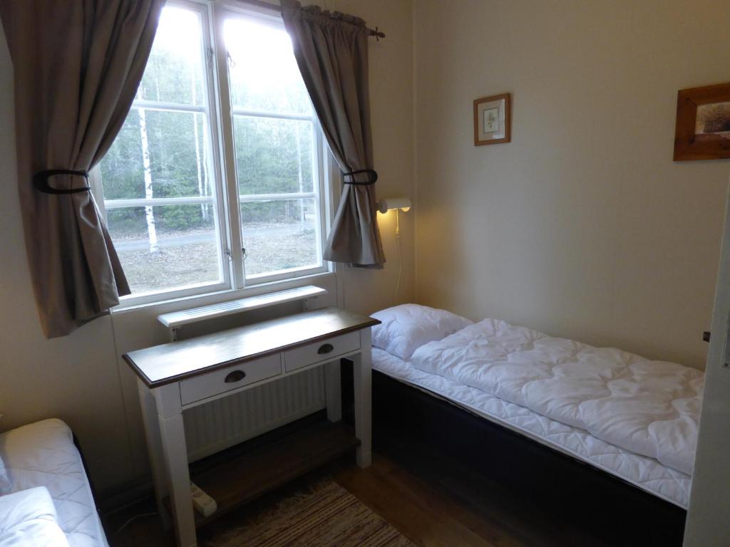Postel nebo postele na pokoji v ubytování Nya Skogsgården Hostel