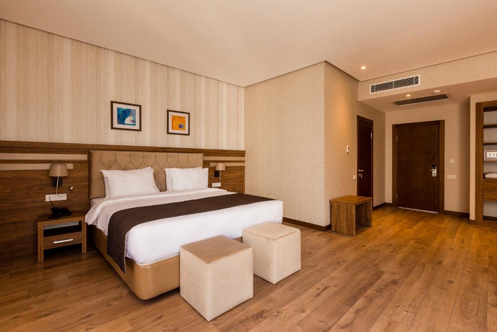 Кровать или кровати в номере City Park Hotel