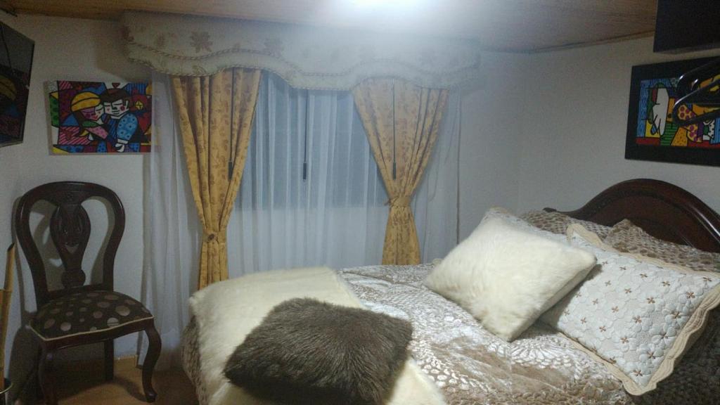 Postel nebo postele na pokoji v ubytování Villa Evelia