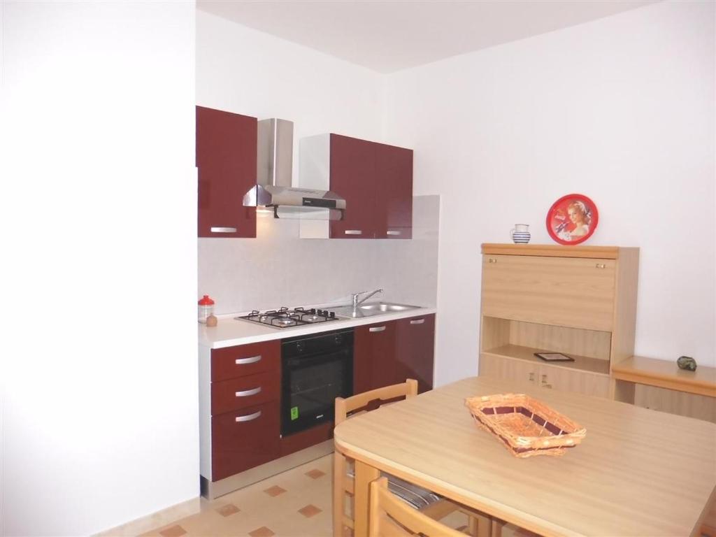 A kitchen or kitchenette at Appartamento Caravaggio