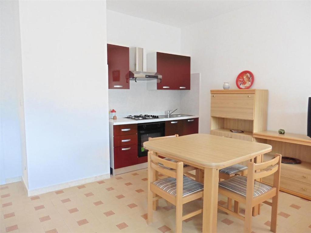 A kitchen or kitchenette at Appartamento Caravaggio