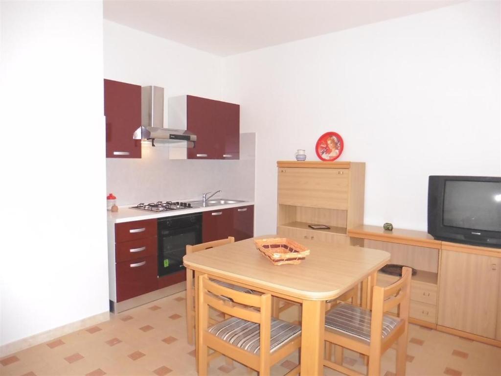 A kitchen or kitchenette at Appartamento Caravaggio