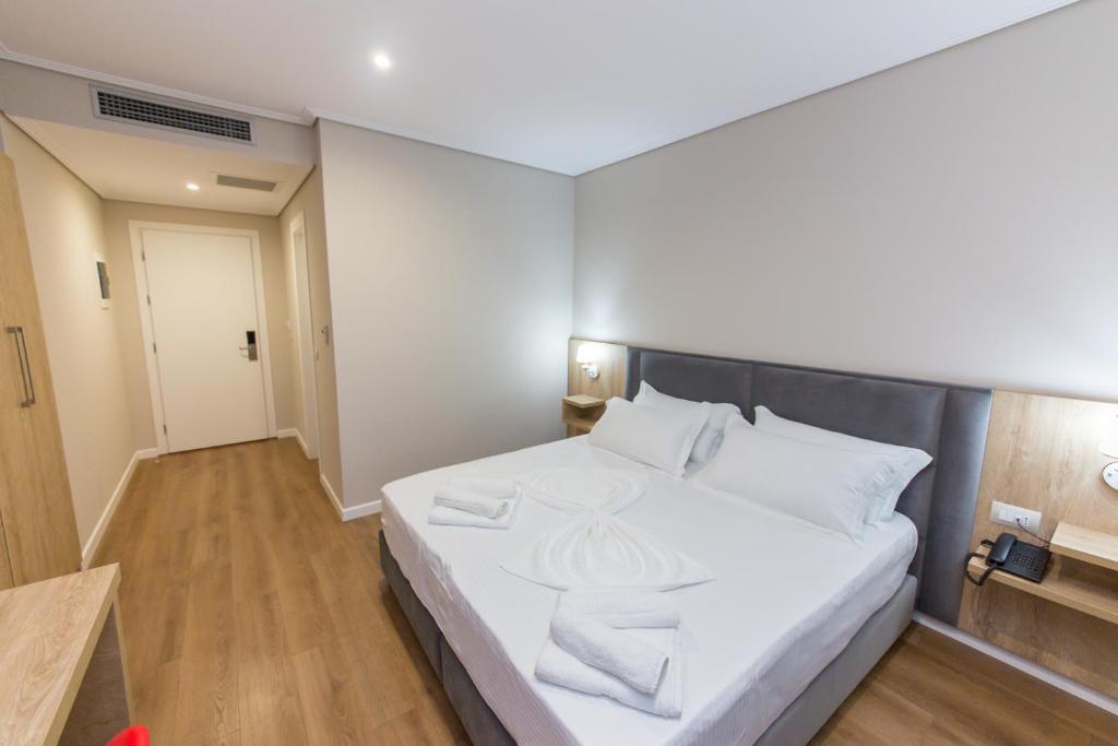 Letto o letti in una camera di CLASS Hotel