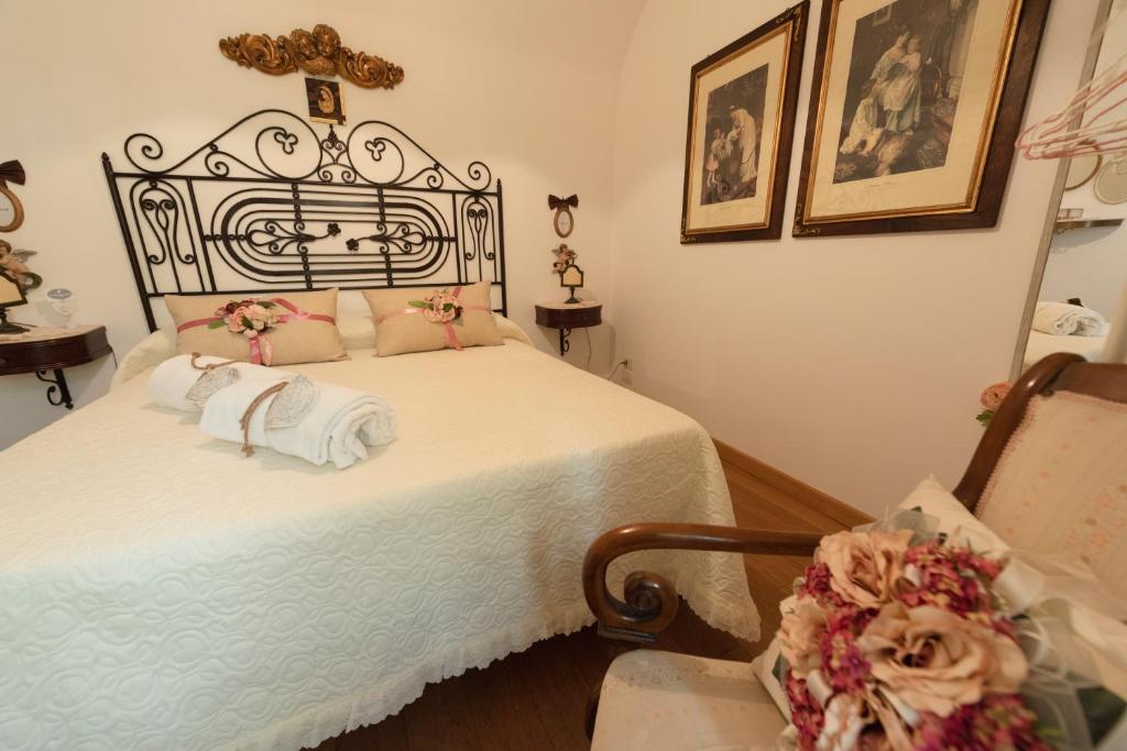 Cama ou camas em um quarto em La Casa degli Angeli