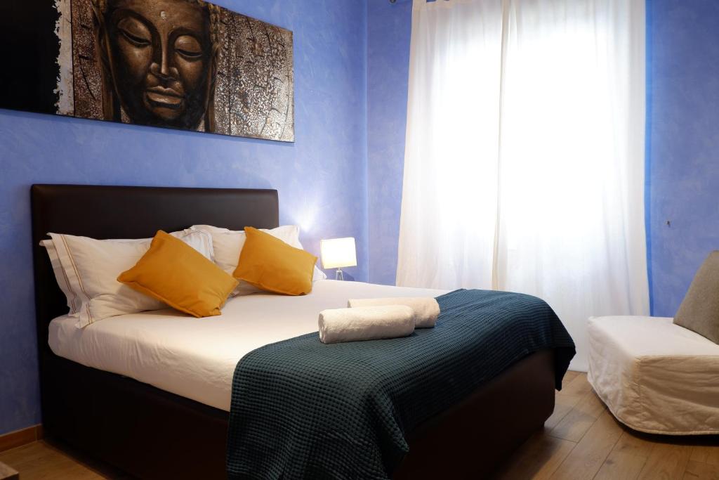 A bed or beds in a room at The Blue Strawberry House in San Giovanni Roma