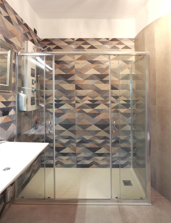 a shower with a glass door in a bathroom at Dimora Villa Serena Porto Selvaggio in Santa Caterina di Nardò