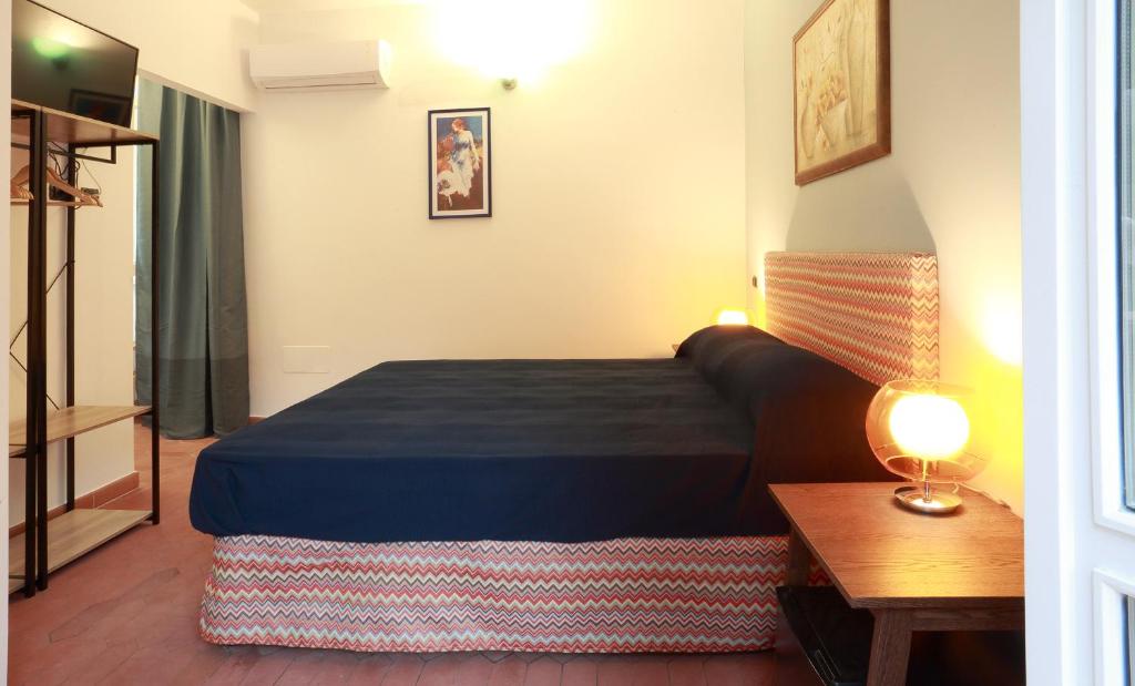 a hotel room with a bed and a table at Dimora Villa Serena Porto Selvaggio in Santa Caterina di Nardò