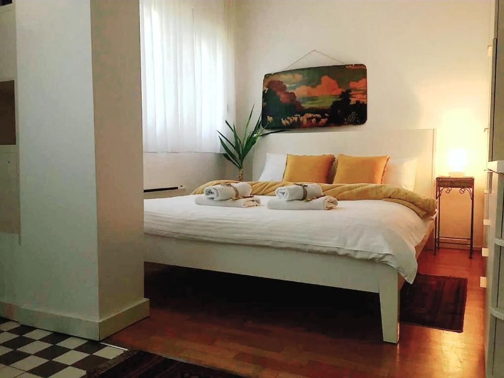 a bedroom with a bed with two stuffed animals on it at Apartment Jastuk in Belgrade
