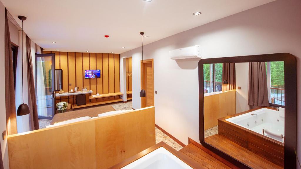 Postel nebo postele na pokoji v ubytování Arwen Hotel