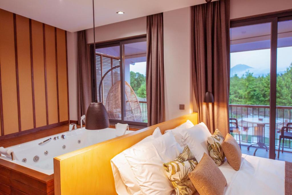 Postel nebo postele na pokoji v ubytování Arwen Hotel
