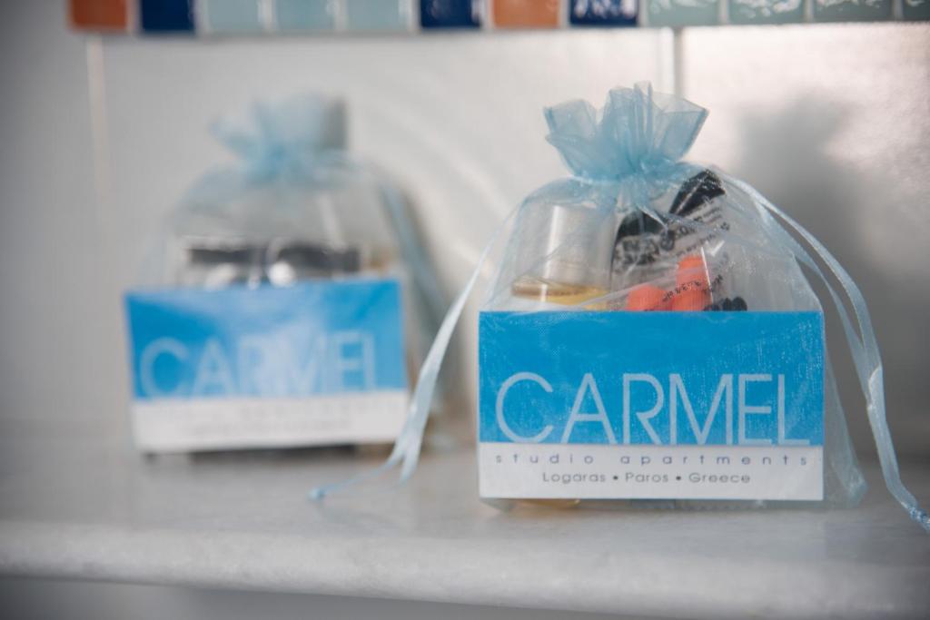 two bags of food sitting on a shelf at Paroscarmel studio-apartment in Logaras