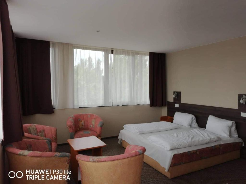 Postel nebo postele na pokoji v ubytování Hotel Tagore