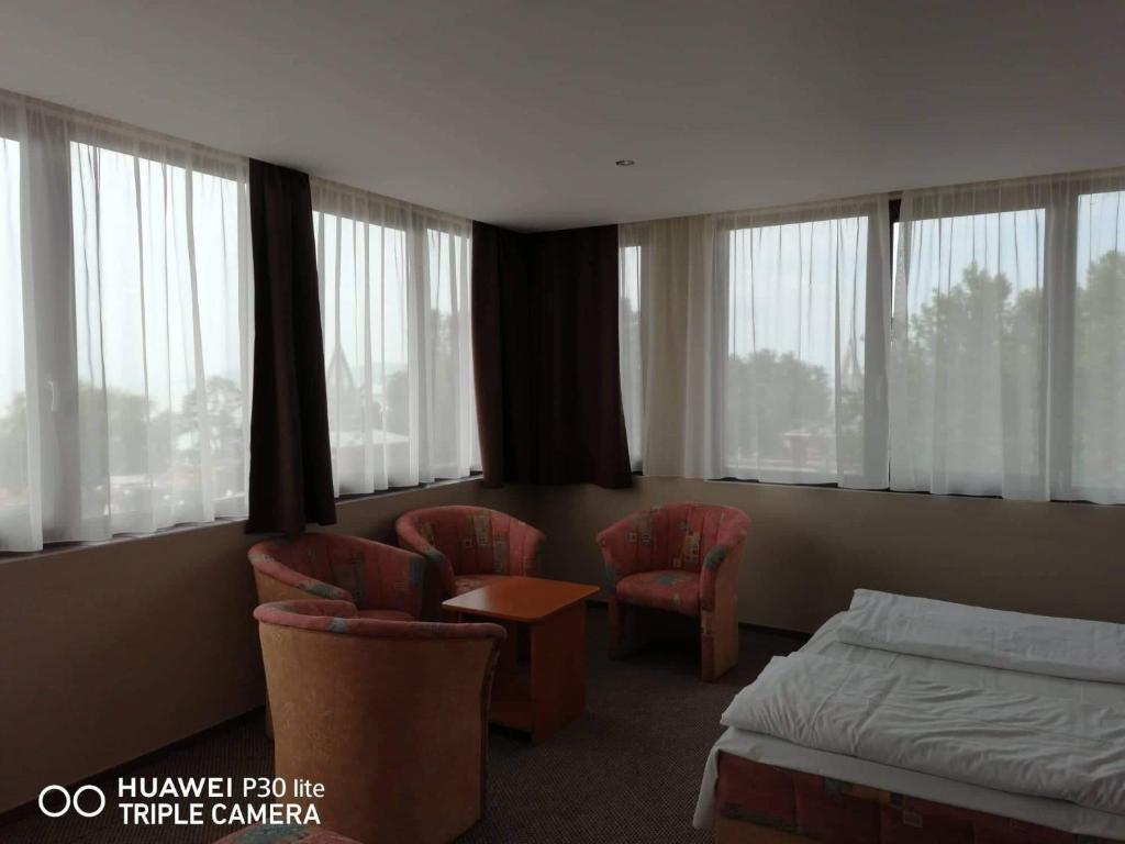 Postel nebo postele na pokoji v ubytování Hotel Tagore