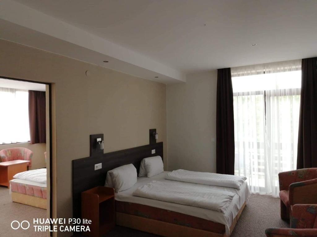 Postel nebo postele na pokoji v ubytování Hotel Tagore