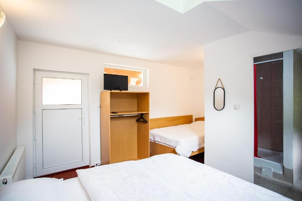 Een bed of bedden in een kamer bij Complex Cazare Balea Transfagarasan
