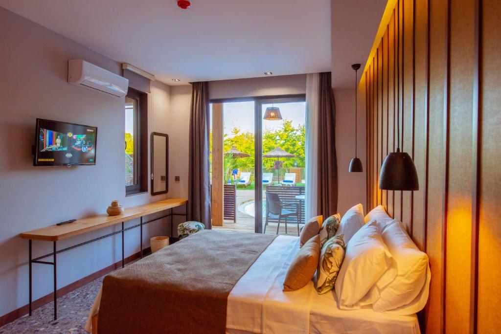 Postel nebo postele na pokoji v ubytování Arwen Hotel