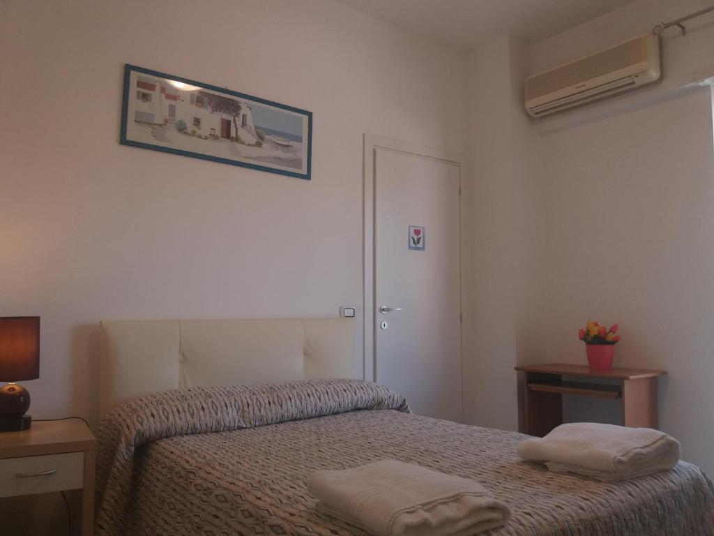 Een bed of bedden in een kamer bij Apartament Silvy Trastevere