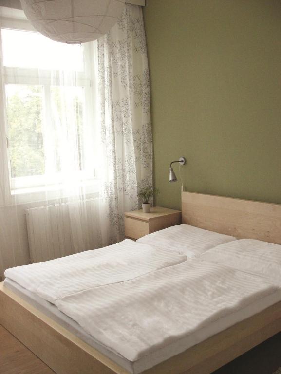 Postel nebo postele na pokoji v ubytování Hotel Saloon