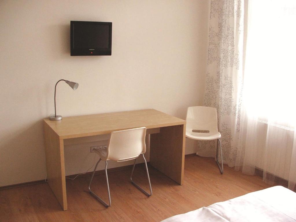 TV a/nebo společenská místnost v ubytování Hotel Saloon