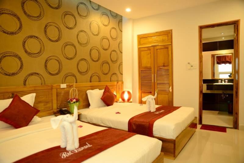 Postel nebo postele na pokoji v ubytování Red Diamond Hotel