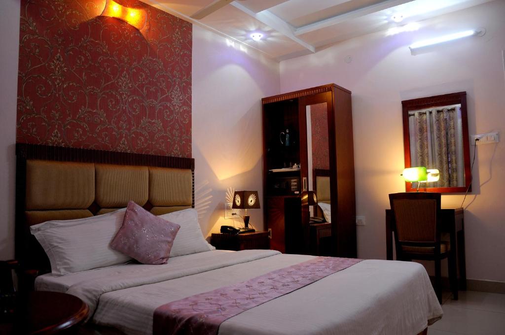 Postel nebo postele na pokoji v ubytování Hotel Kings Kastle