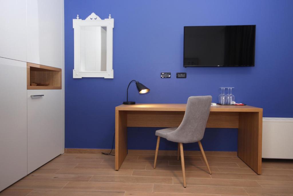 Een TV en/of entertainmentcenter bij Rooms Alla Beccaccia
