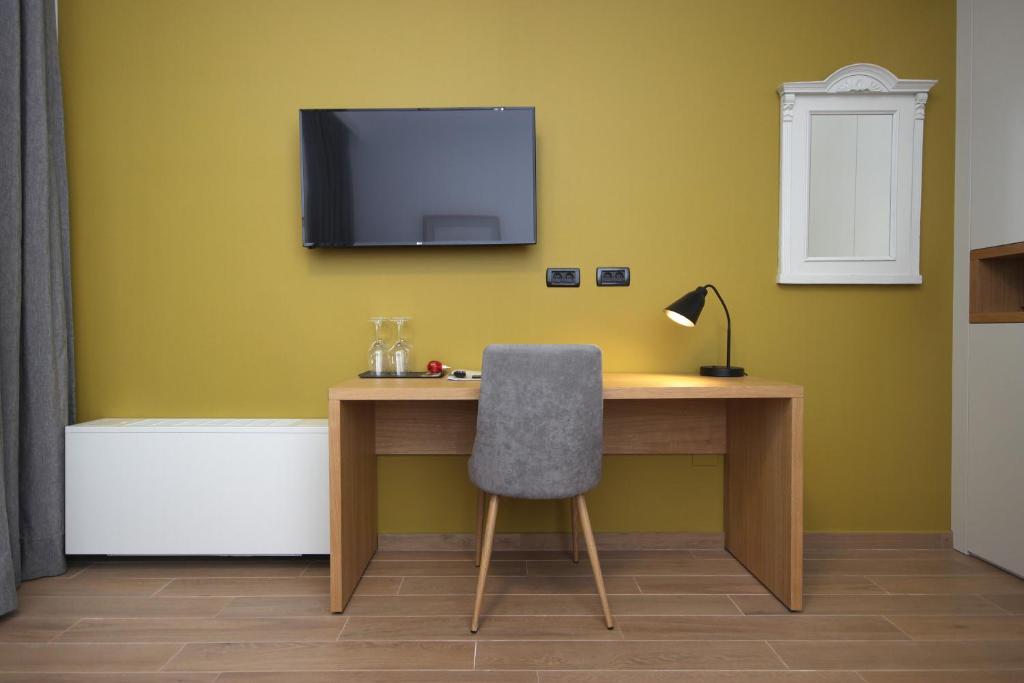 Een TV en/of entertainmentcenter bij Rooms Alla Beccaccia
