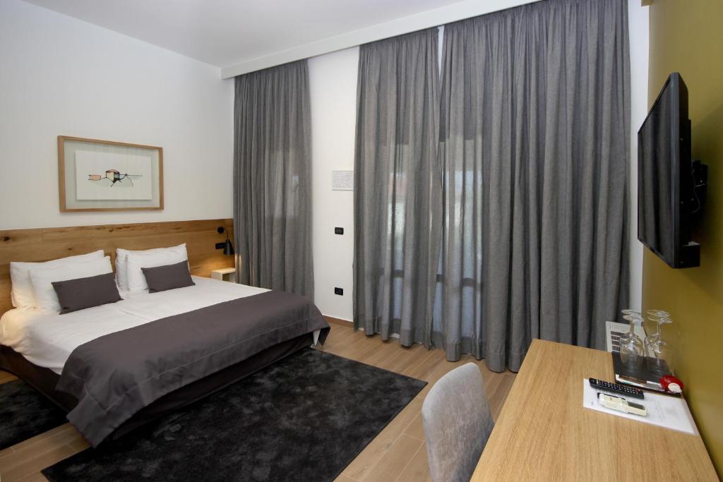 Een bed of bedden in een kamer bij Rooms Alla Beccaccia