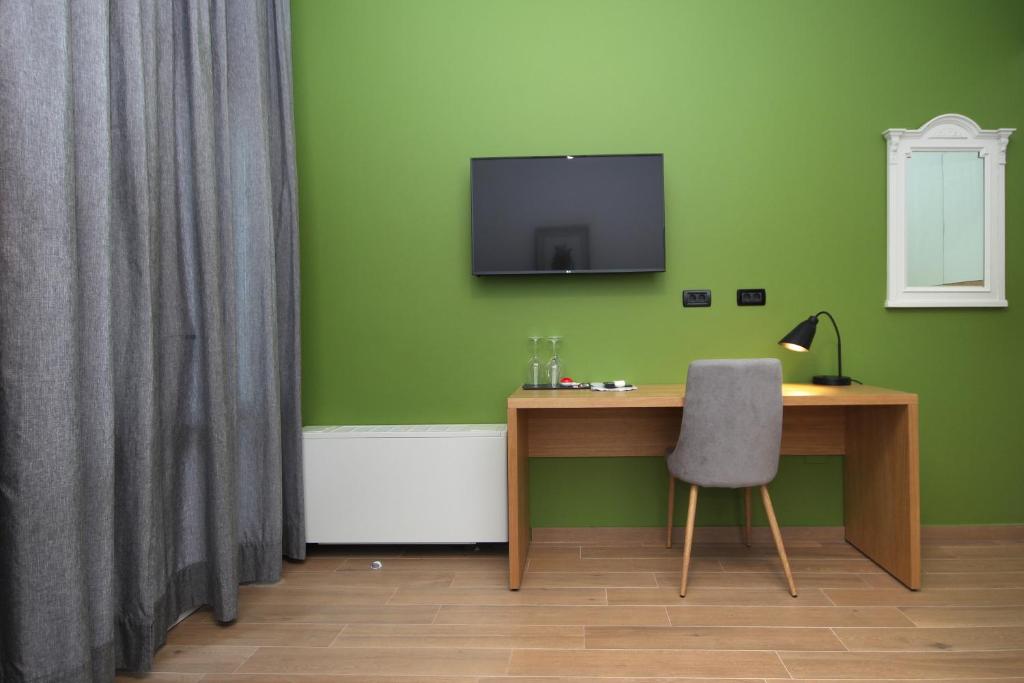 Een TV en/of entertainmentcenter bij Rooms Alla Beccaccia

