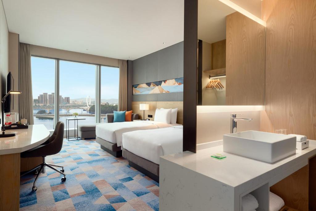 Postel nebo postele na pokoji v ubytování Hyatt Place Liuzhou