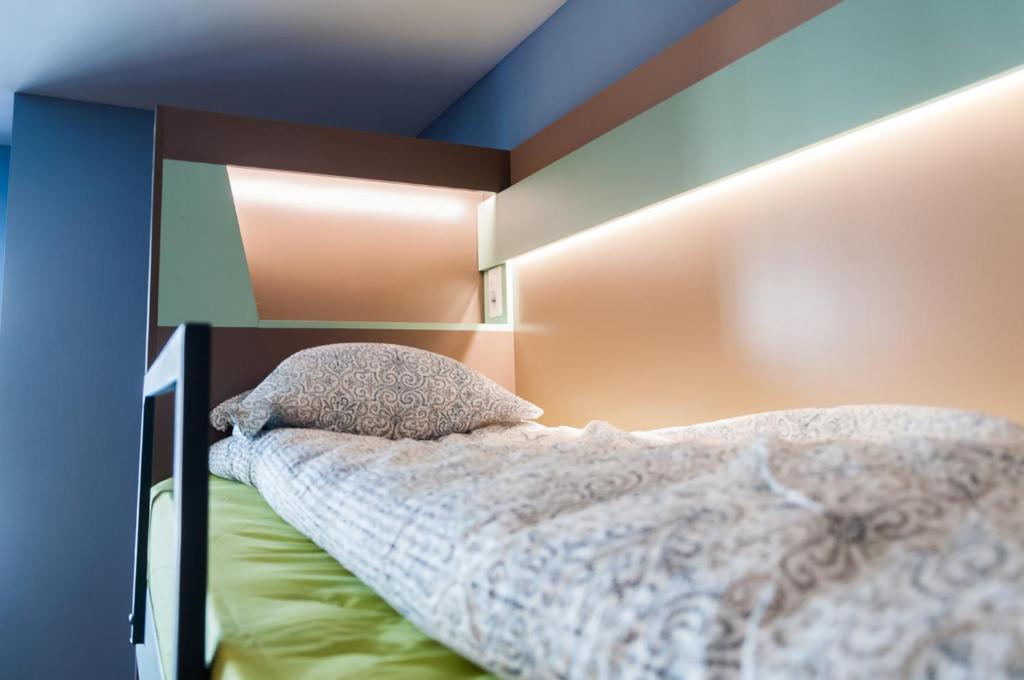 Postel nebo postele na pokoji v ubytování Ura Hostel