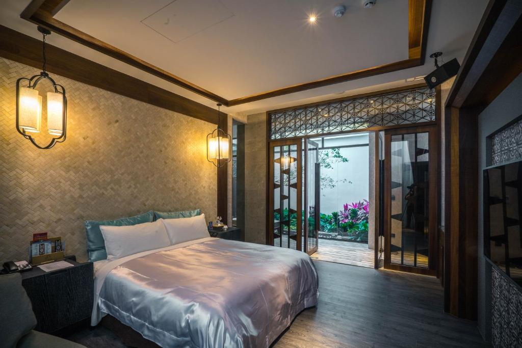 Postel nebo postele na pokoji v ubytování Shu Xin Motel
