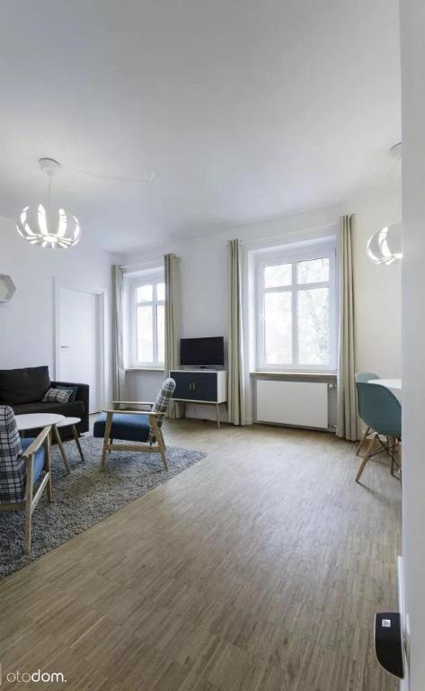 Posedenie v ubytovaní Stylowy 2-pokojowy apartament 5 min. od Rynku