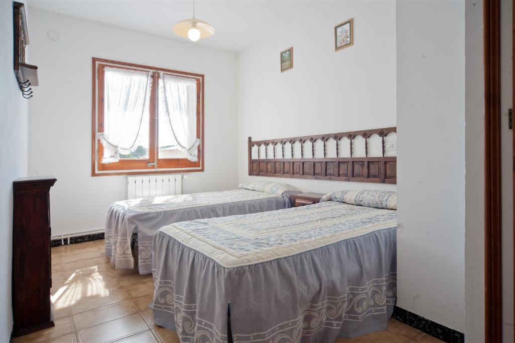 Postel nebo postele na pokoji v ubytování Lledoners
