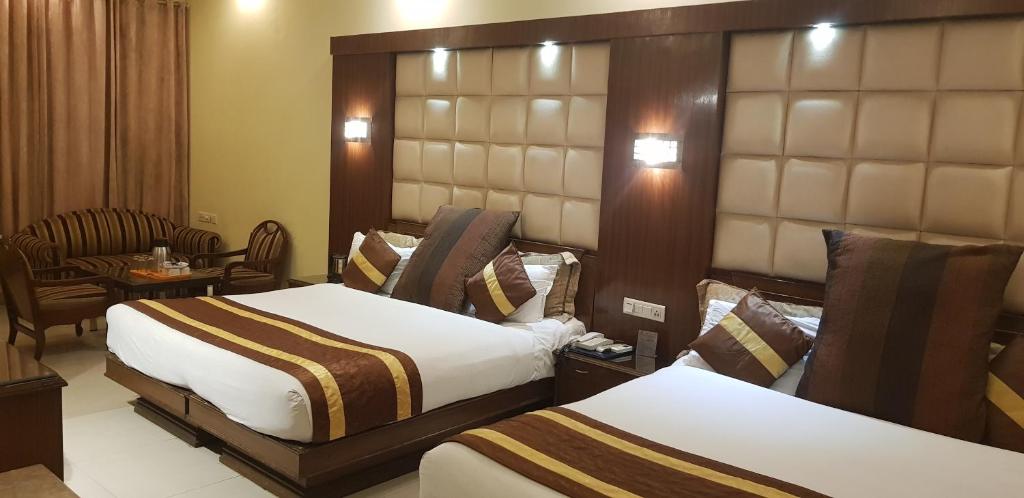 Postel nebo postele na pokoji v ubytování Hotel CJ International