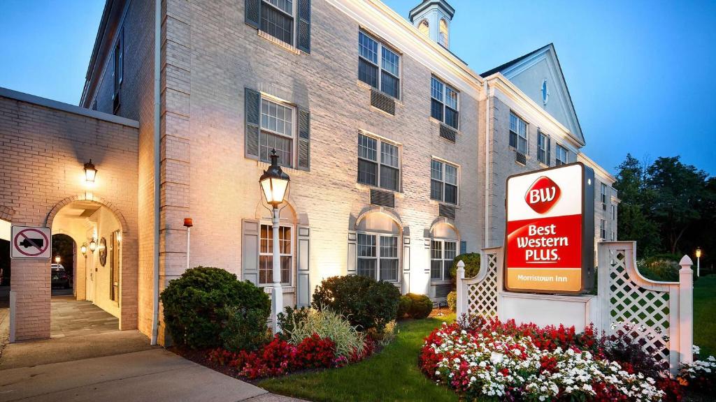 a hotel with a sign in front of a building at Best Western PLUS Morristown Inn in Morristown