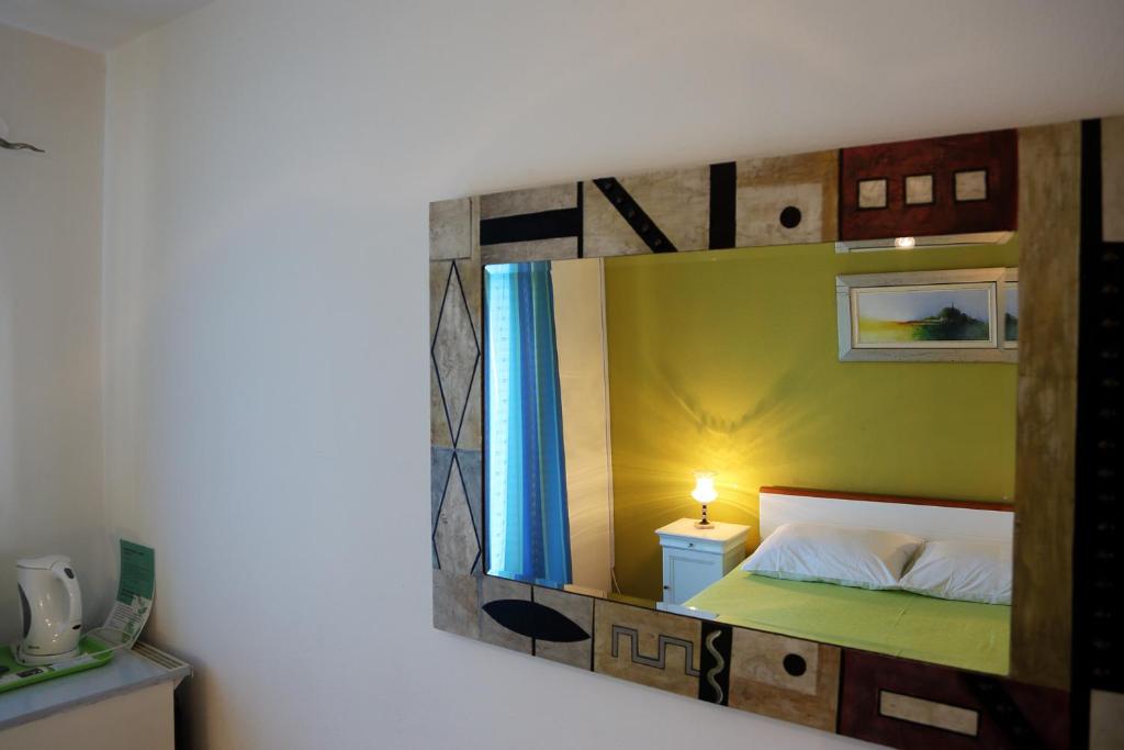 Łóżko lub łóżka w pokoju w obiekcie Tanya-Apartments and Rooms