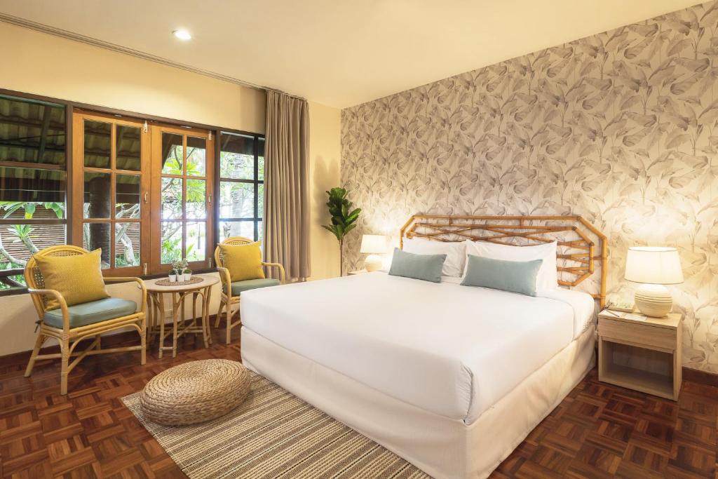 Rúm í herbergi á Regent - Chalet, Hua Hin