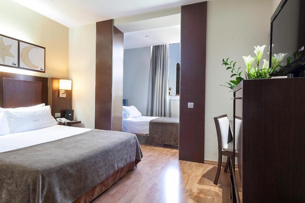 Posteľ alebo postele v izbe v ubytovaní Acta Atrium Palace