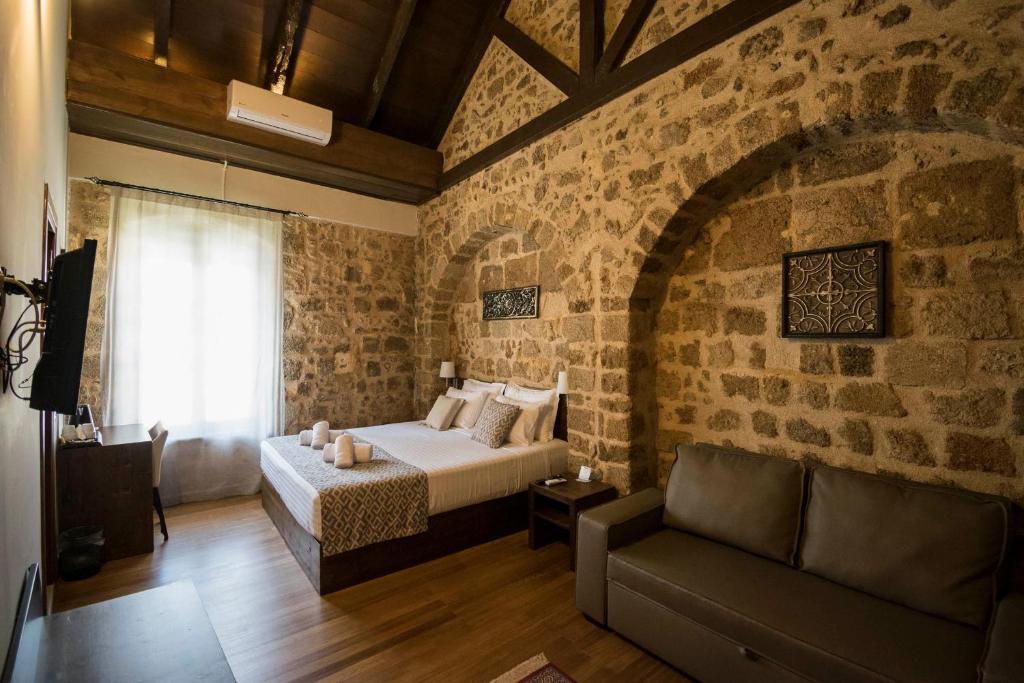 Postel nebo postele na pokoji v ubytování D'Argento Boutique Rooms