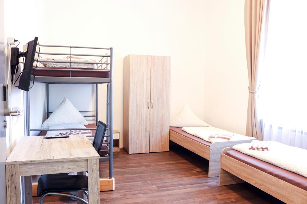 Postel nebo postele na pokoji v ubytování FMM Hostel