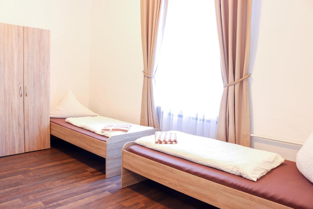 Postel nebo postele na pokoji v ubytování FMM Hostel
