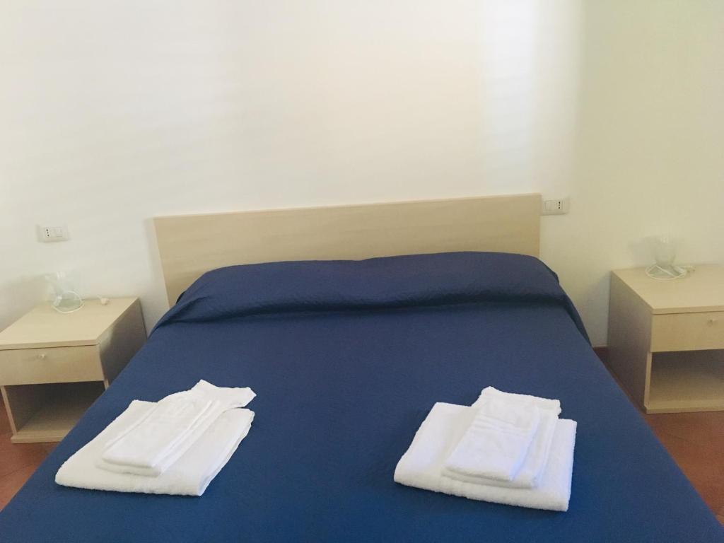 Postel nebo postele na pokoji v ubytování Albergo Villamarina
