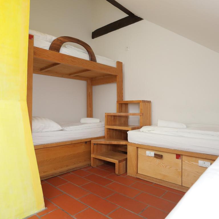 Postel nebo postele na pokoji v ubytování Hostel Celica