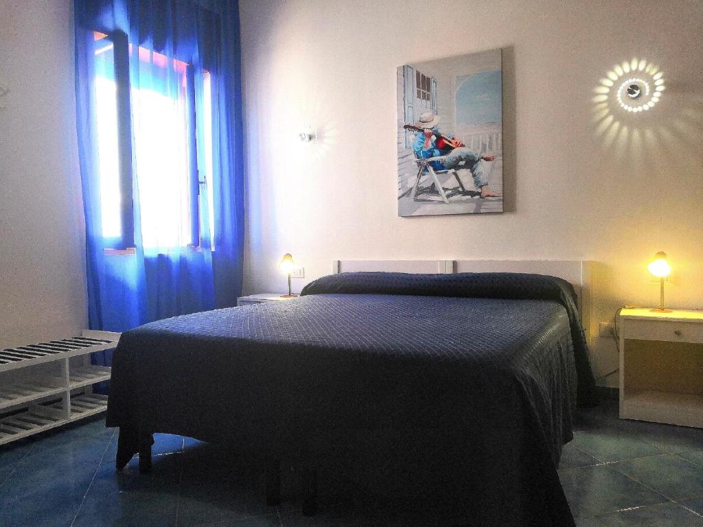 Postel nebo postele na pokoji v ubytování B&B Villa Passiaturo