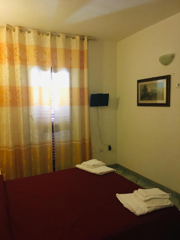 Postel nebo postele na pokoji v ubytování Albergo Villamarina