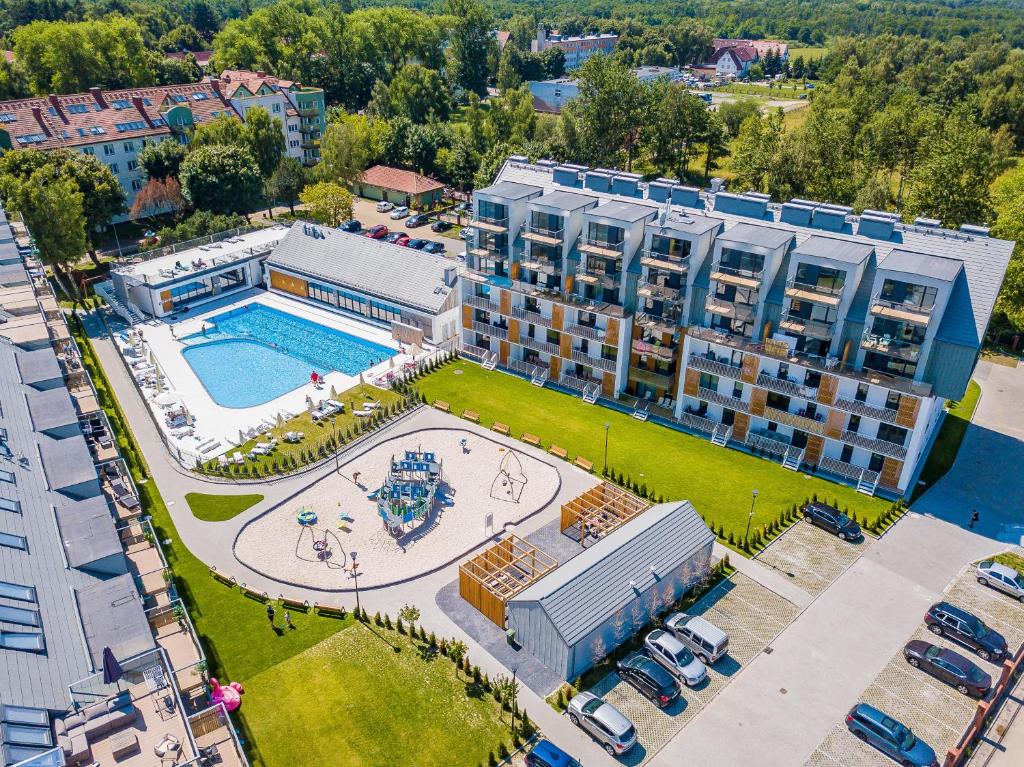 an aerial view of an apartment complex with a basketball court at Michano Apartamenty in Kołobrzeg