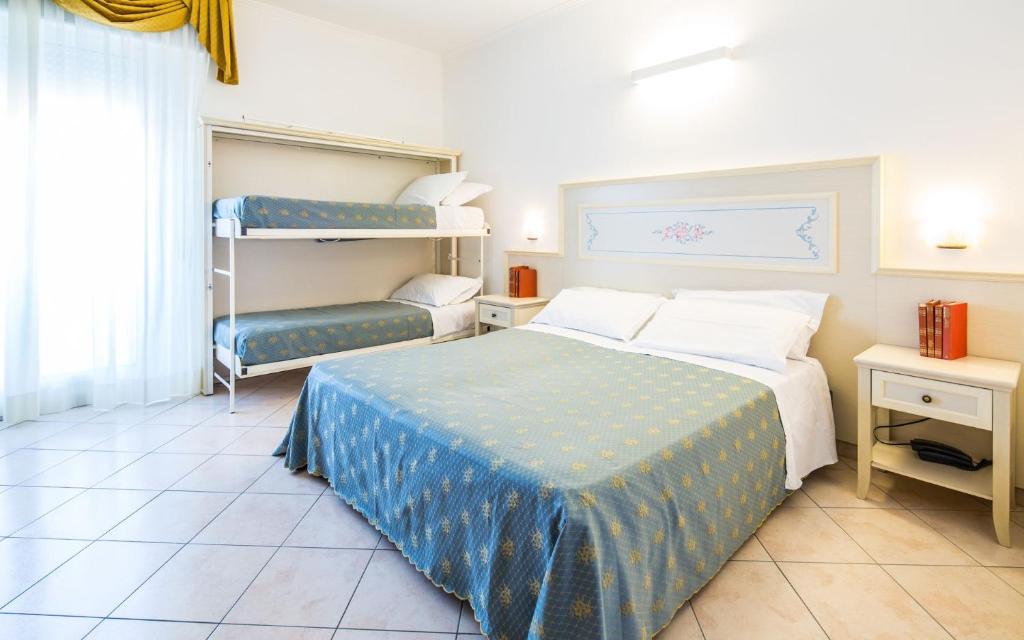 Postel nebo postele na pokoji v ubytování Hotel Principe