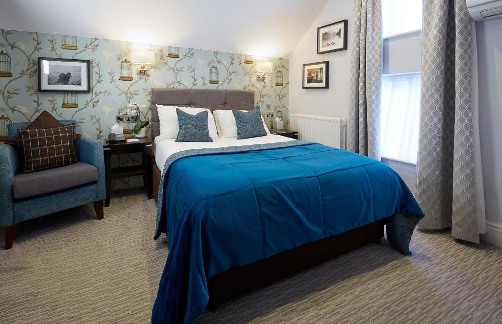 Un ou plusieurs lits dans un hébergement de l'établissement Mandolay Hotel Guildford